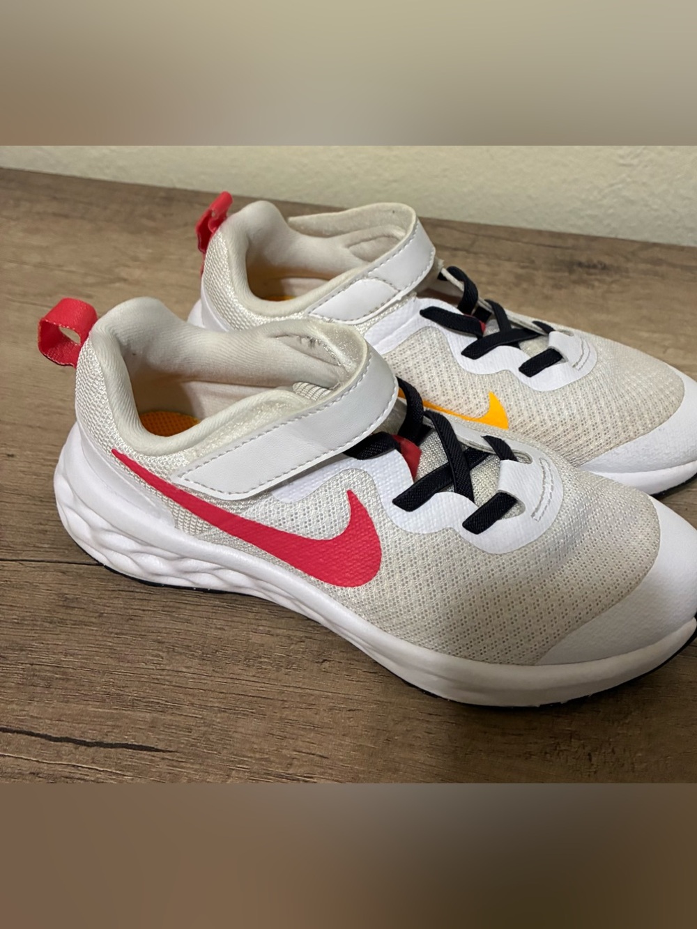 Girls Nike Kids White Sneakers with Pink Swoosh and Yellow Accent